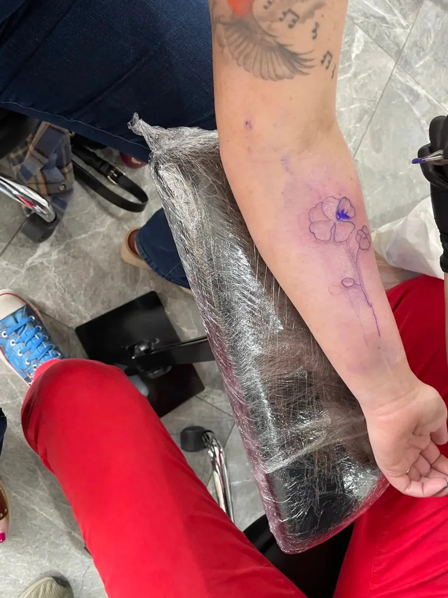 Flower tattoo stencil on forearm